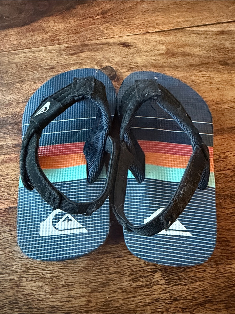 Quiksilver Navy Flip Flops with Rainbow Stripe